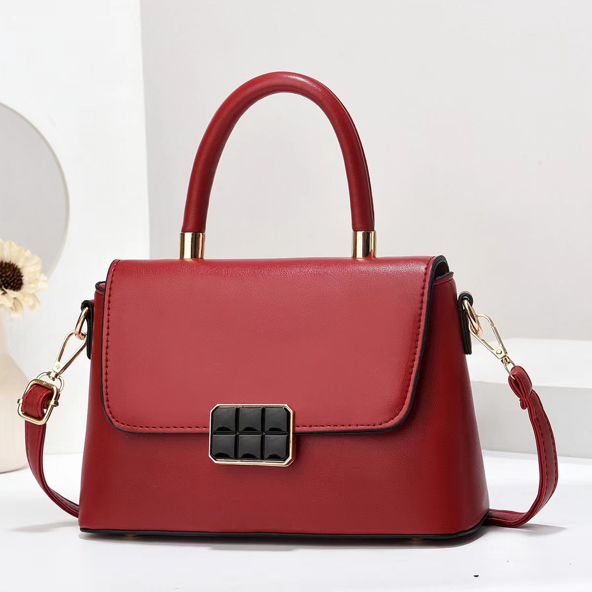 Macaron-colored handbag with a shoulder strap