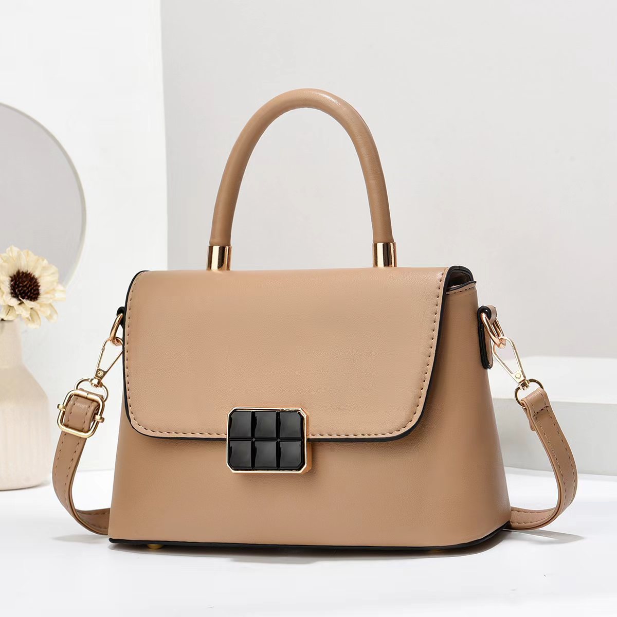 Macaron-colored handbag with a shoulder strap