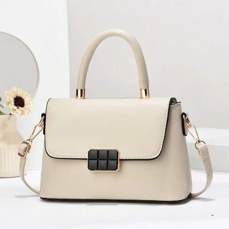 Macaron-colored handbag with a shoulder strap