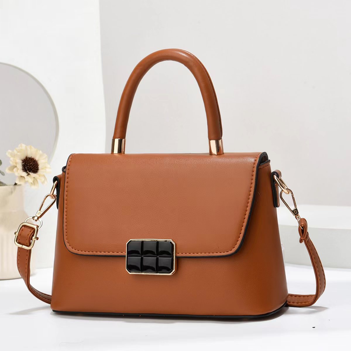 Macaron-colored handbag with a shoulder strap